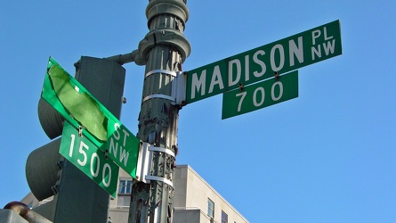 Street signs at the intersection of Madison Place and H Street NW