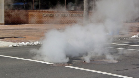 Steam emitting from manholes on 17th Street NW