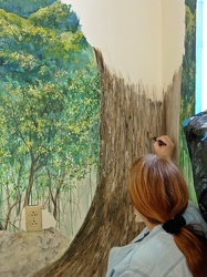 Artist painting a mural