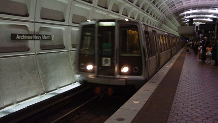 Train arriving at Archives-Navy Memorial station