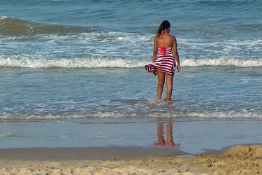 Woman standing in the surf