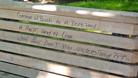 Political graffiti on a bench