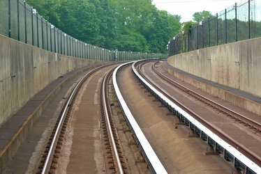 Tracks descending into a tunnel