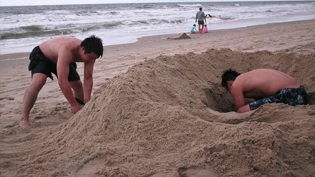 Family digging in the sand [03]