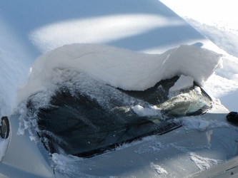 Partly cleared car following Snowpocalypse storm