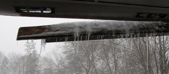 Damaged gutter system hanging from building [01]