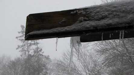 Damaged gutter system hanging from building [02]