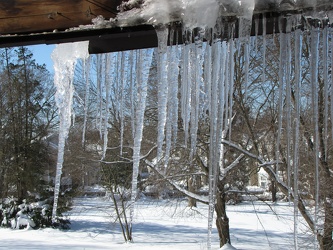 Damaged gutter system hanging from building [06]