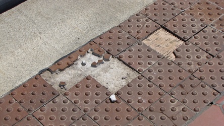 Missing and cracked platform tiles at New Carrollton