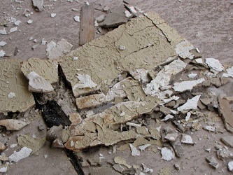 Fallen drywall on abandoned motel guest building