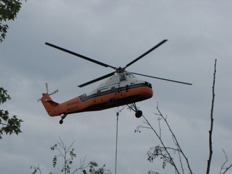 Helicopter delivering a rooftop HVAC unit [01]