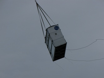 Helicopter delivering a rooftop HVAC unit [03]