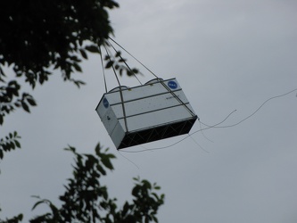 Helicopter delivering a rooftop HVAC unit [04]