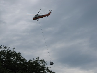 Helicopter delivering a rooftop HVAC unit [05]