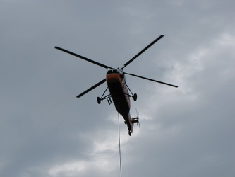 Helicopter delivering a rooftop HVAC unit [06]