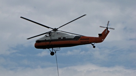 Helicopter delivering a rooftop HVAC unit [07]