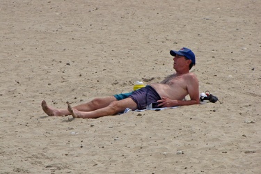 Man laying on the beach in Chicago