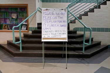 Sign about stairs at Olney Indoor Swim Center