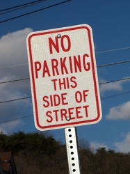 "No parking this side of street"