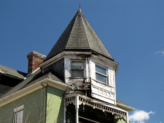 House with deteriorated uppermost level