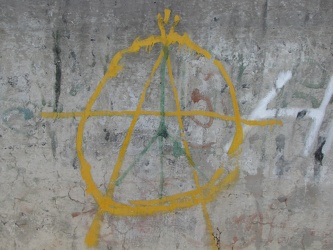 Anarchy sign painted on a wall