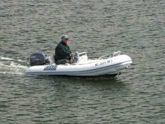 Man operates powerboat through Annapolis Harbor