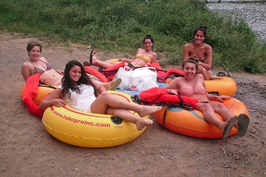 Group posing for a photo on tubes