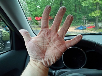 Wrinkled hands following tubing adventure