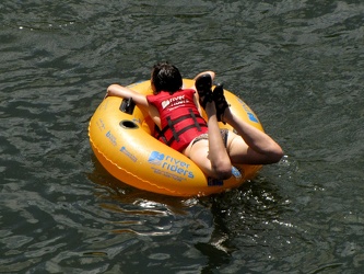 Woman laying on inner tube [01]