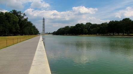 Washington Monument in scaffolding, viewed from the west end of the Lincoln Memorial Reflecting Pool [10]