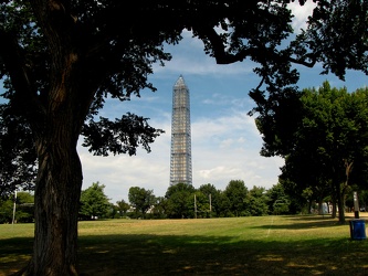 Washington Monument in scaffolding, viewed from a field west of 15th Street SW [01]