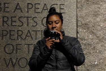 Woman taking a photo at the FDR Memorial