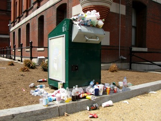 Overflowing solar compactor trash can