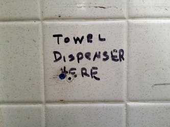 "TOWEL DISPENSER HERE"