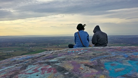 Two women looking at their cell phones at High Rock