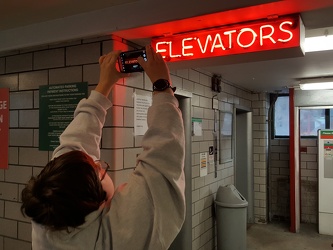 Photographing an elevator sign