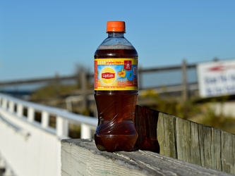 Bottle of Lipton tea on the boardwalk [01]