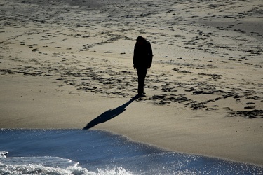 Woman walking the beach [01]