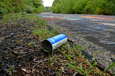 Discarded spray paint can [11]