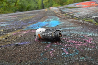 Discarded spray paint can [14]