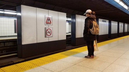 Woman standing on the platform at North York Centre