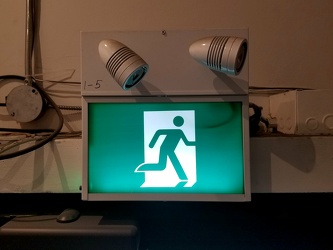 "Running man" exit sign at Chronic Ink