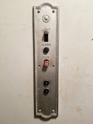 Elevator panel at Chronic Ink