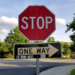 One way and stop sign