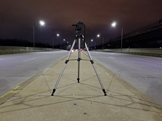 Camera on tripod photographing Benning Road NE [01]