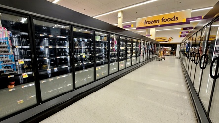 Sparsely filled frozen food aisle at Giant Food