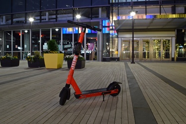 Jump scooter in the middle of a plaza