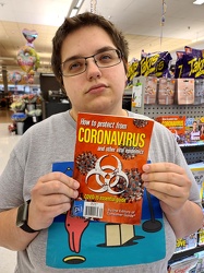 Elyse holds up a coronavirus magazine