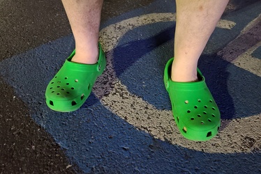 Standing in green Crocs