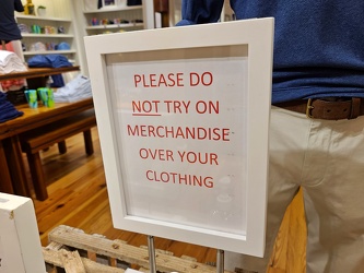 "Please do NOT try on merchandise over your clothing"